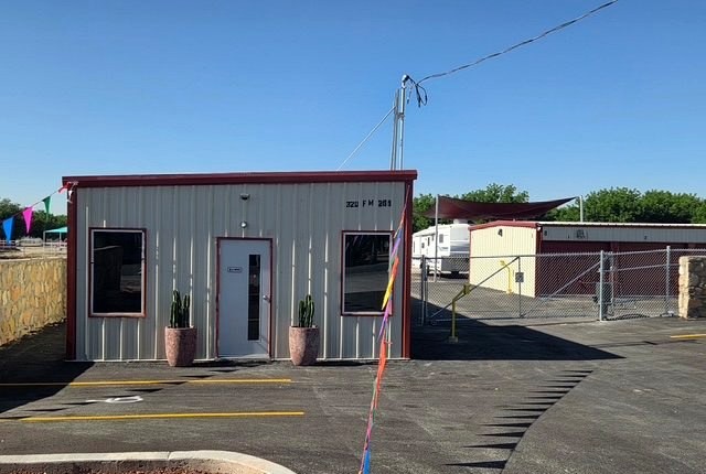 The on-site office at Canutillo Self Storage with the address sign visible from the entrance gate.